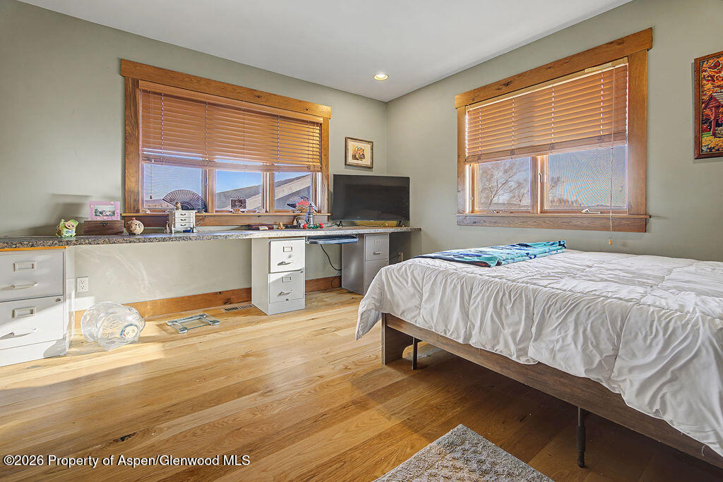 1040 Bryan Way Craig, CO 81625 - Photo 18 of 54 a spacious bedroom with a large bed and a large window
