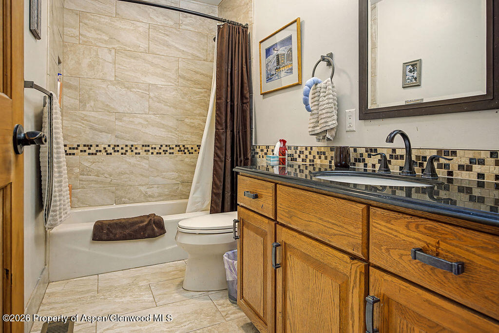 1040 Bryan Way Craig, CO 81625 - Photo 19 of 54 a bathroom with a sink a toilet and shower