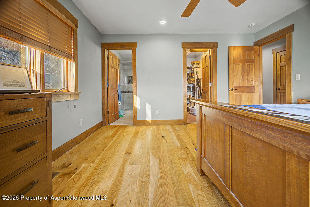 1040 Bryan Way Craig, CO 81625 - Photo 20 of 54 a view of an empty room with wooden floor and a window