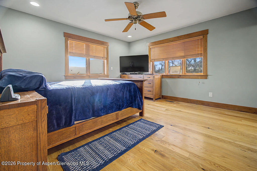 1040 Bryan Way Craig, CO 81625 - Photo 21 of 54 a bedroom with furniture and a flat screen tv