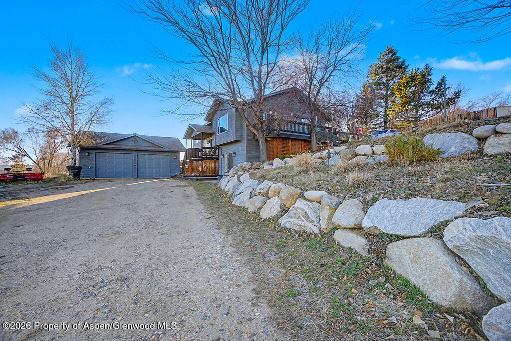 1040 Bryan Way Craig, CO 81625 - Photo 3 of 54 a view of a house with a yard