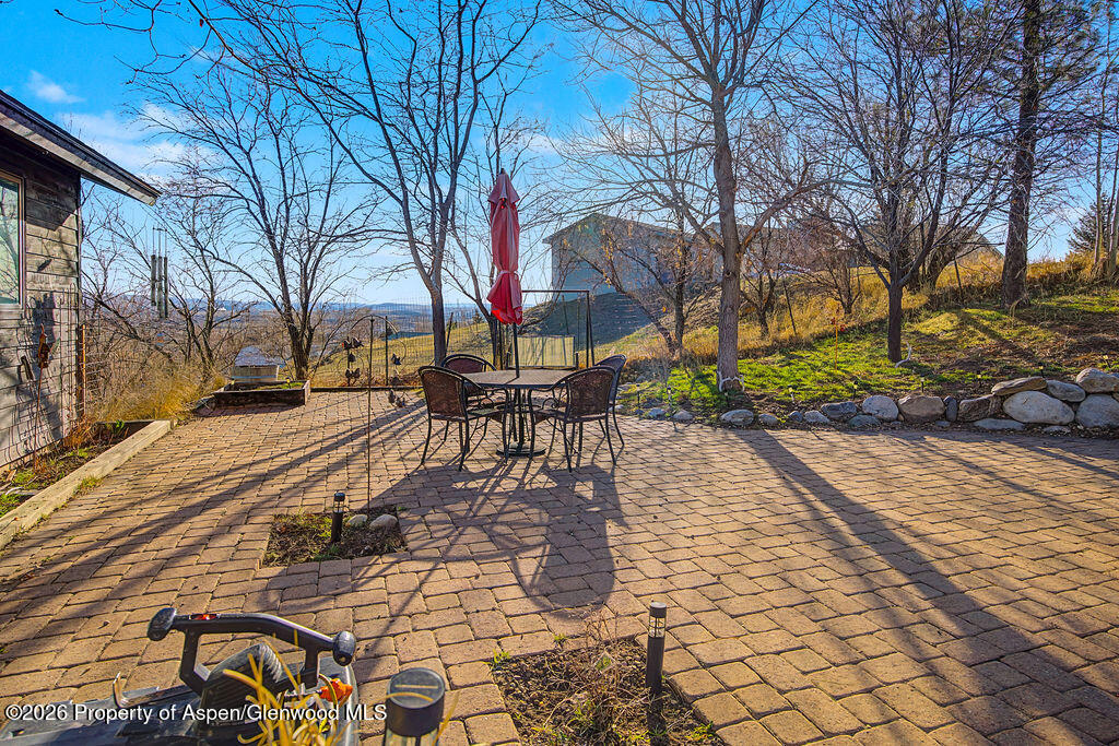 1040 Bryan Way Craig, CO 81625 - Photo 31 of 54 a view of a yard with plants and trees