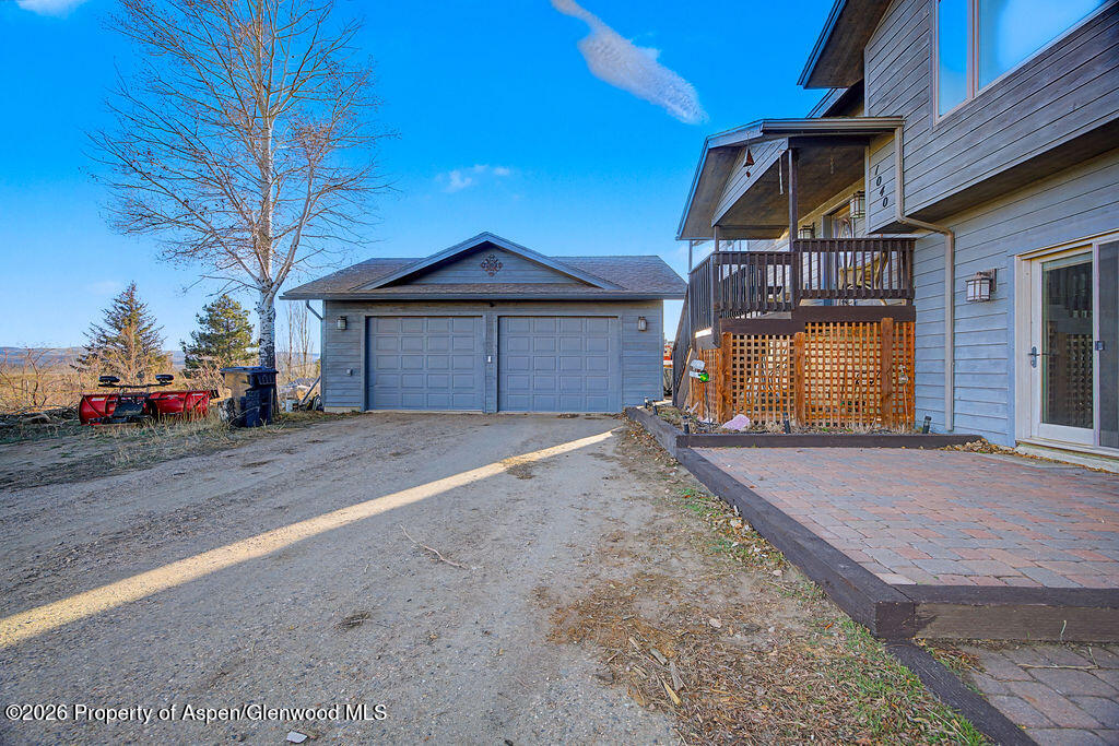 1040 Bryan Way Craig, CO 81625 - Photo 5 of 54 a front view of a house with a yard and garage