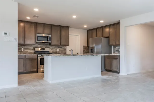 a bathroom with sinks a vanity and a mirror