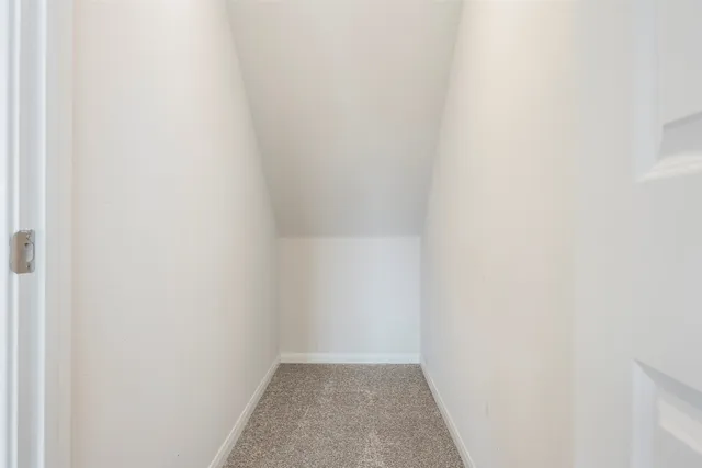 a kitchen with granite countertop stainless steel appliances cabinets a sink and a counter top space