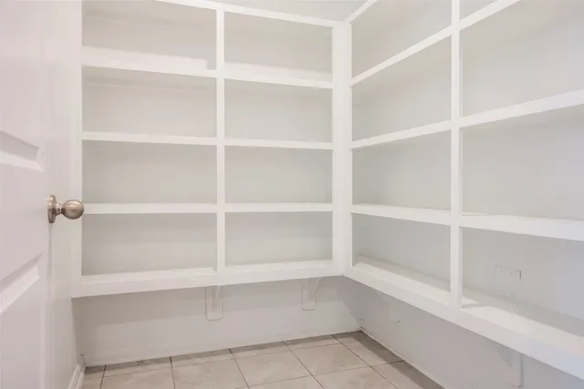 a kitchen with stainless steel appliances granite countertop a sink a stove and microwave