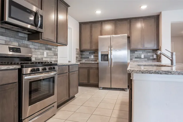 an empty room with windows and entrance