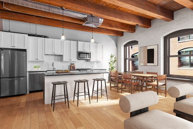 a kitchen with stainless steel appliances granite countertop a refrigerator a stove a sink dishwasher and white cabinets with wooden floor