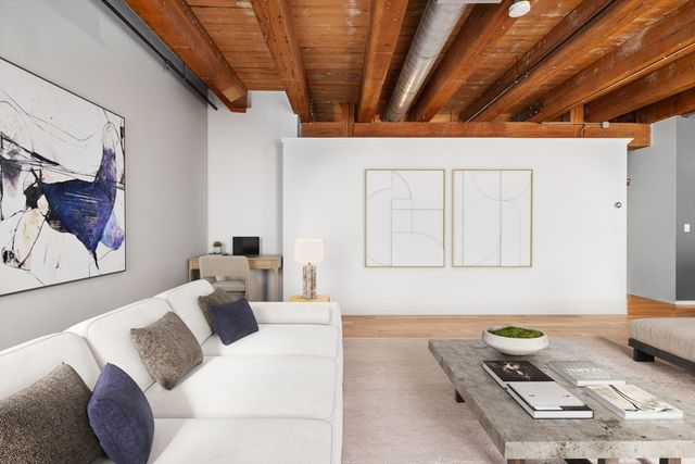 a bedroom with bed and a window