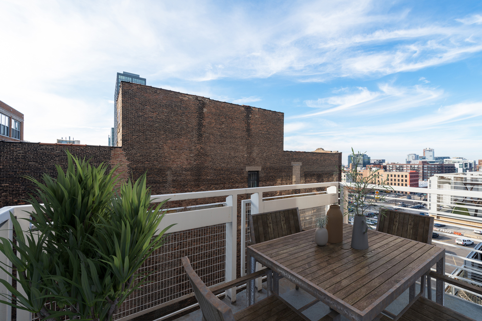 933 West Van Buren Street, Unit 824 Chicago, IL 60607 - Photo 13 of 18 a terrace of a house with wooden floor