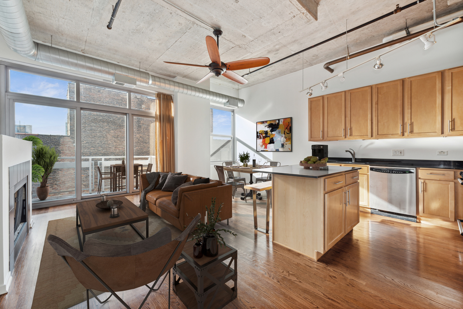 933 West Van Buren Street, Unit 824 Chicago, IL 60607 - Photo 2 of 18 a kitchen with granite countertop lots of counter top space and wooden floors