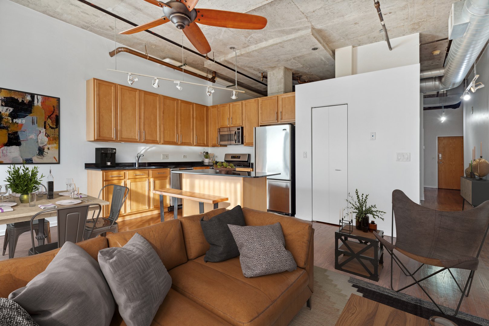 933 West Van Buren Street, Unit 824 Chicago, IL 60607 - Photo 5 of 18 a living room with furniture and a window