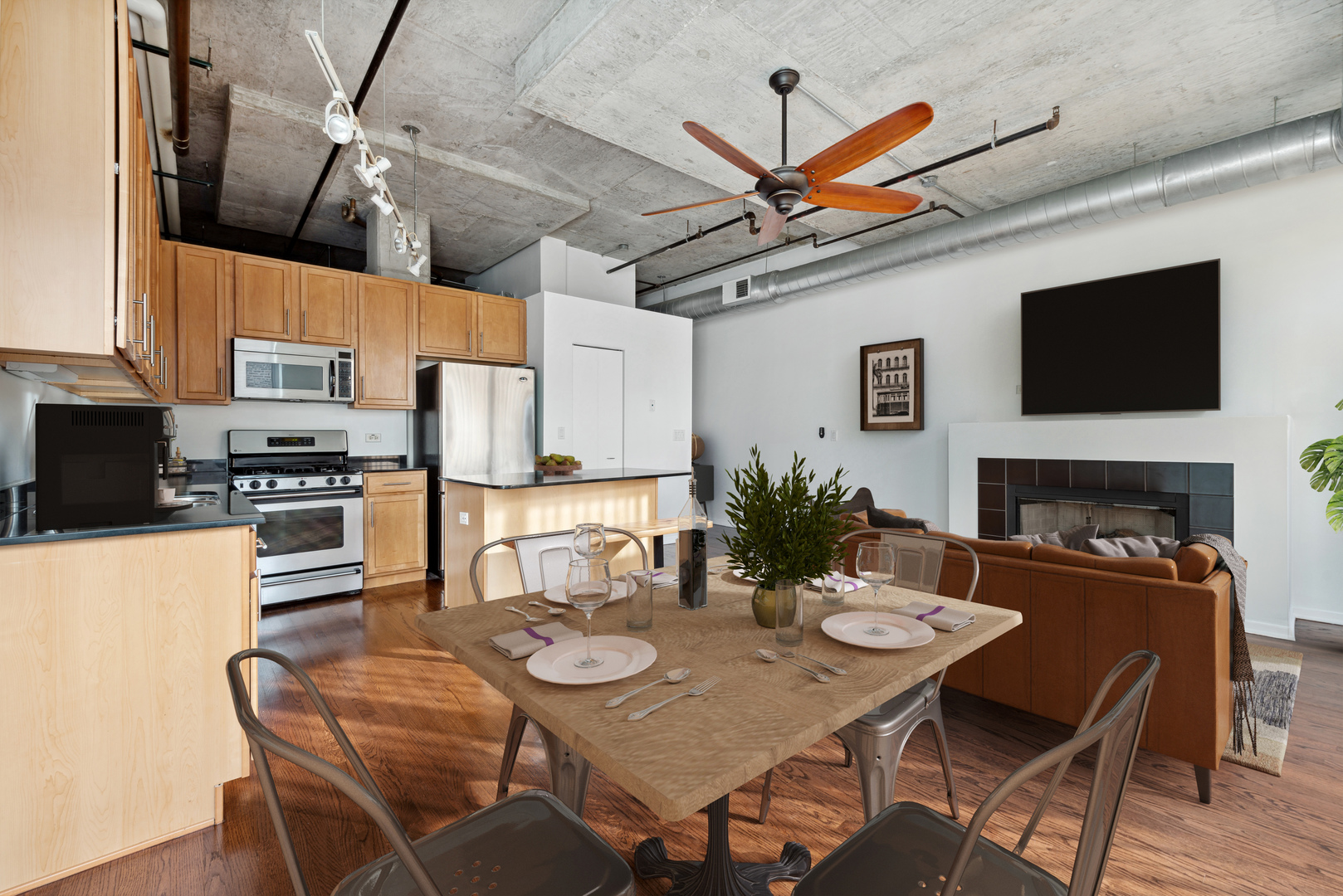 933 West Van Buren Street, Unit 824 Chicago, IL 60607 - Photo 6 of 18 a view of a dining room with furniture and a kitchen
