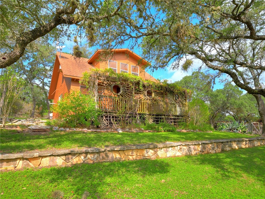 320 Northwest Hills Road San Marcos, TX 78666 - Photo 1 of 1 a view of an house with backyard space and garden