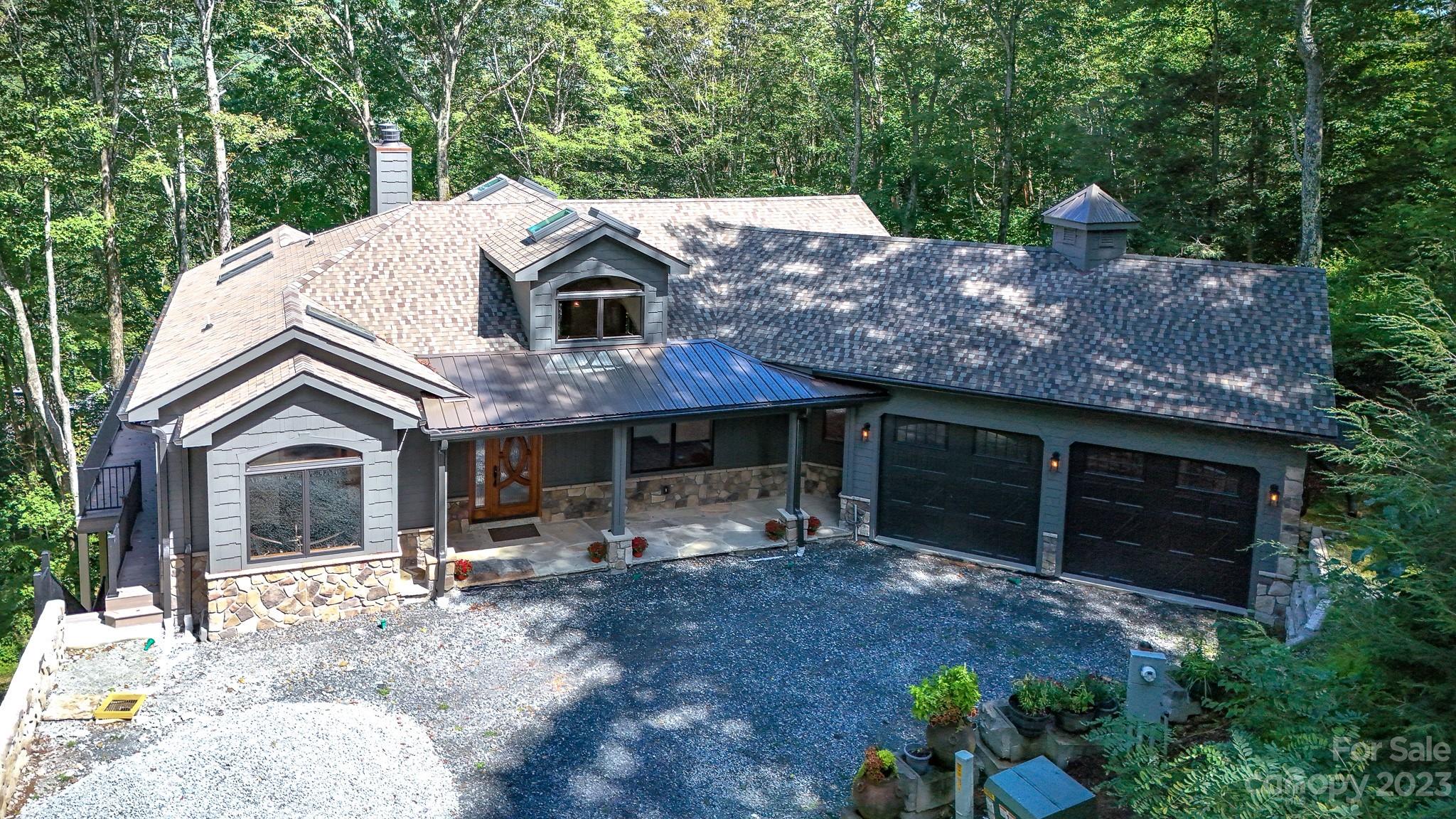 a view of house with yard and entertaining space