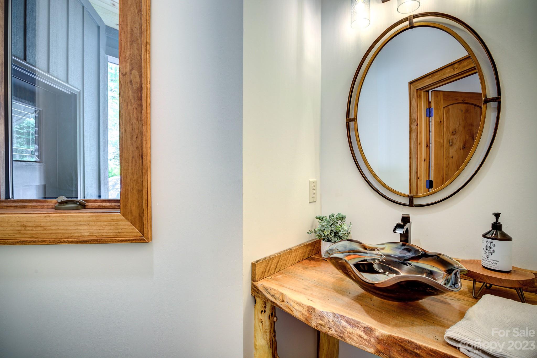 53 Laurel Ridge Lane, Unit 26 Banner Elk, NC 28604 - Photo 19 of 41 a bathroom with a sink and a mirror