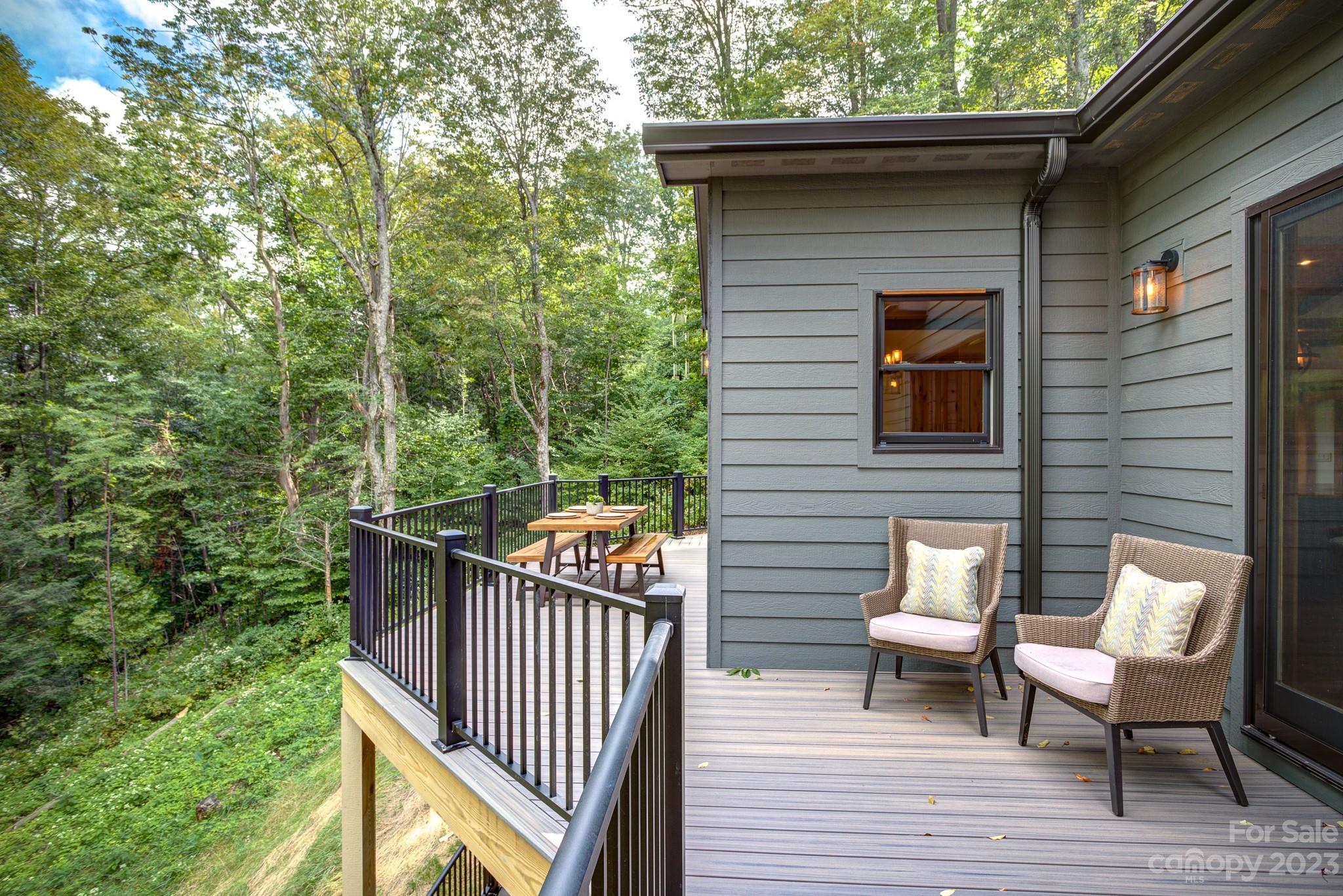 53 Laurel Ridge Lane, Unit 26 Banner Elk, NC 28604 - Photo 26 of 41 a balcony with wooden floor table and chairs