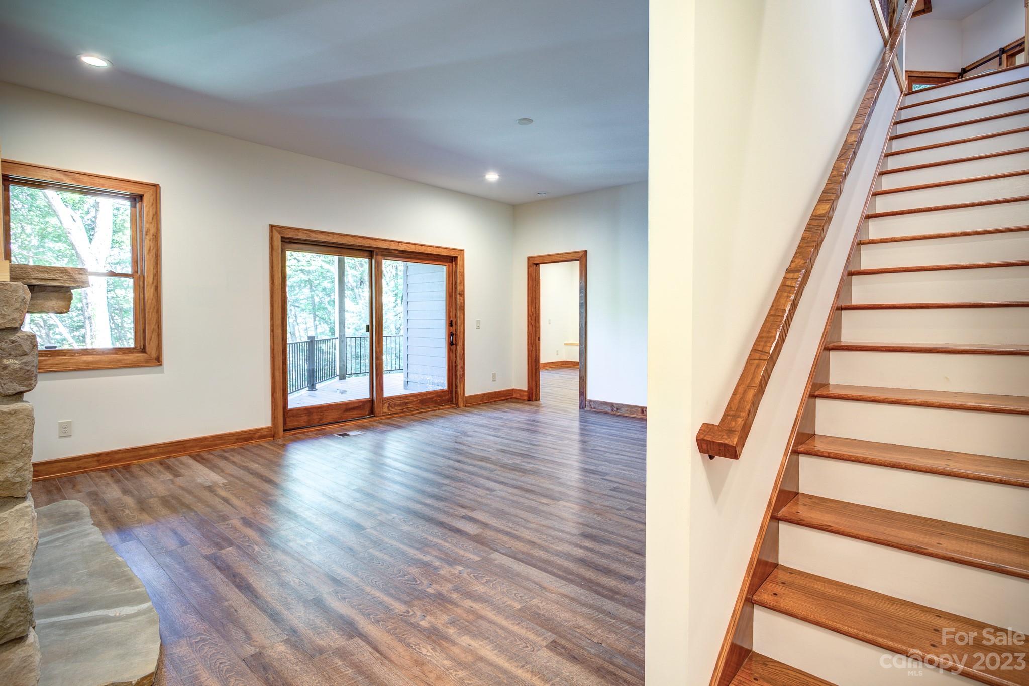 53 Laurel Ridge Lane, Unit 26 Banner Elk, NC 28604 - Photo 28 of 41 a view of an entryway with wooden floor and stairs