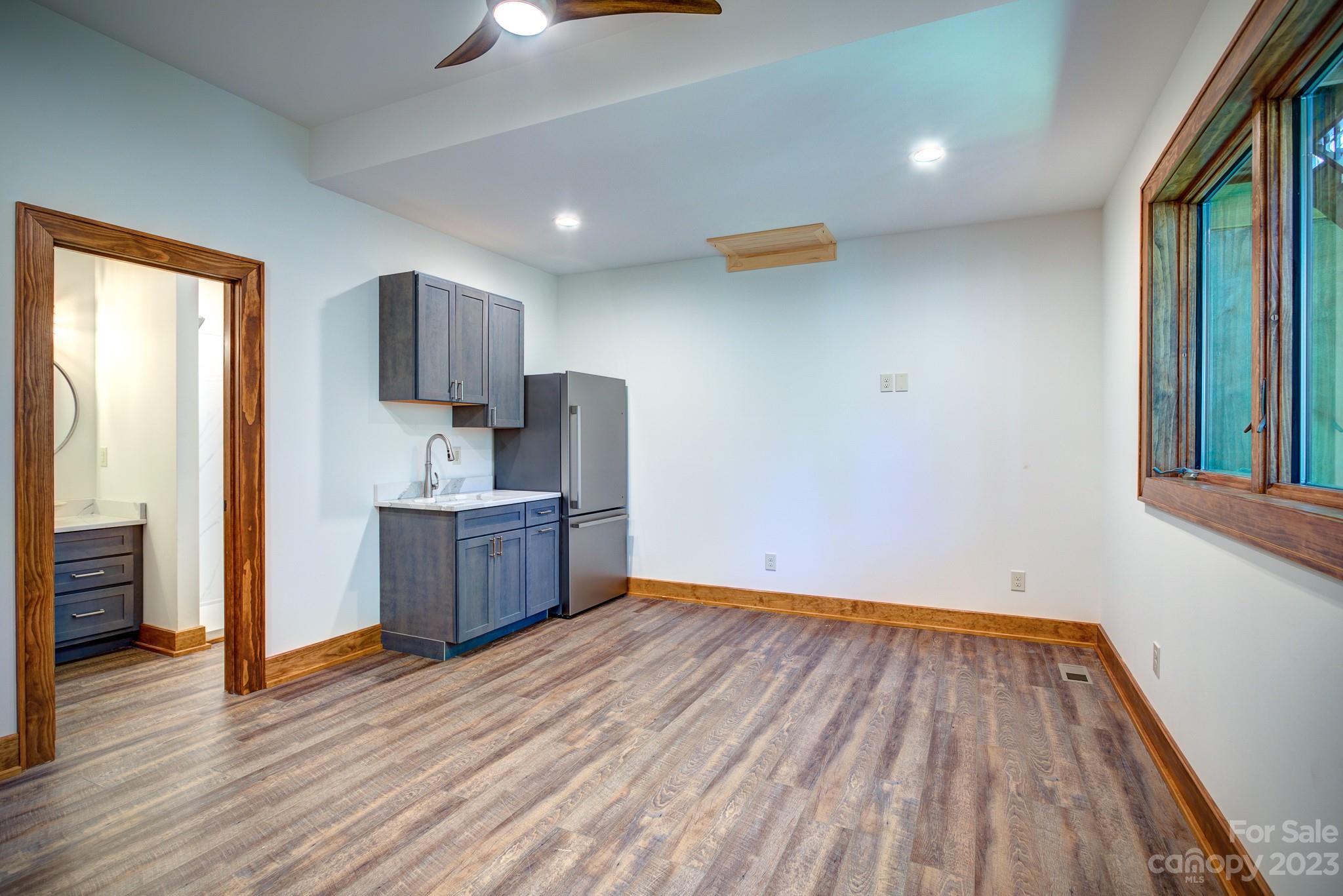 53 Laurel Ridge Lane, Unit 26 Banner Elk, NC 28604 - Photo 30 of 41 a kitchen with wooden floors and a sink