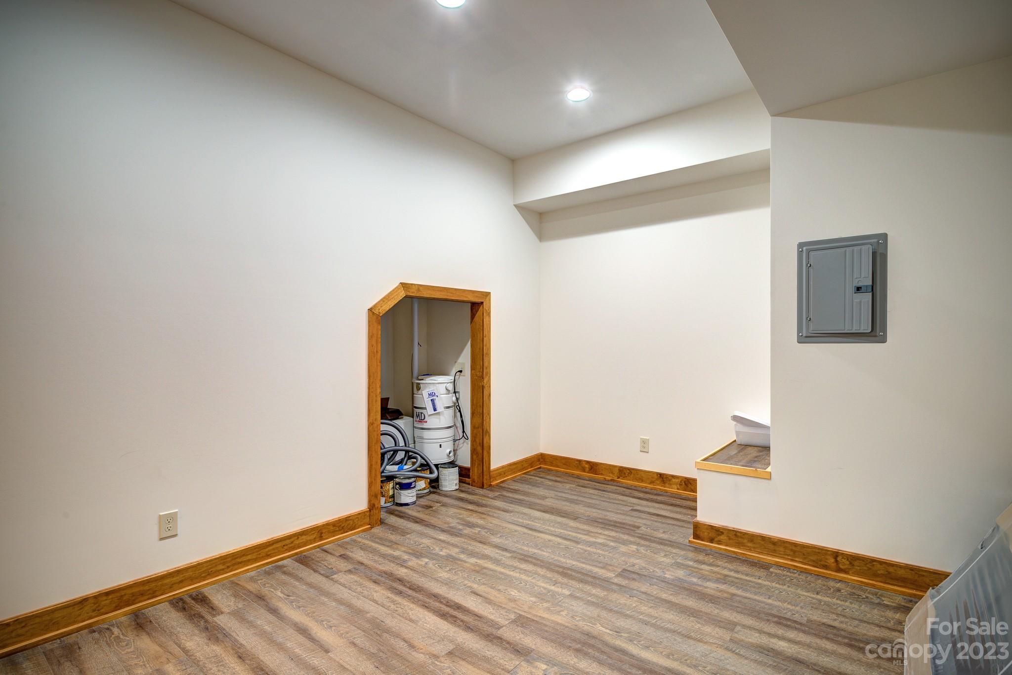 53 Laurel Ridge Lane, Unit 26 Banner Elk, NC 28604 - Photo 36 of 41 an empty room with wooden floor and windows