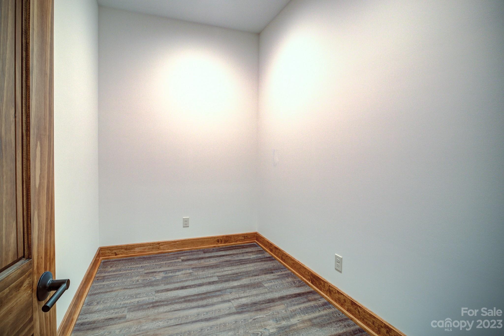 53 Laurel Ridge Lane, Unit 26 Banner Elk, NC 28604 - Photo 37 of 41 a view of empty room with wooden floor