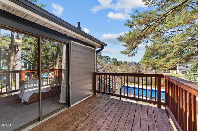 a view of a balcony with wooden floor