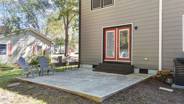 a view of a house with brick walls and potted plants