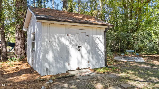 an aerial view of a house with a swimming pool