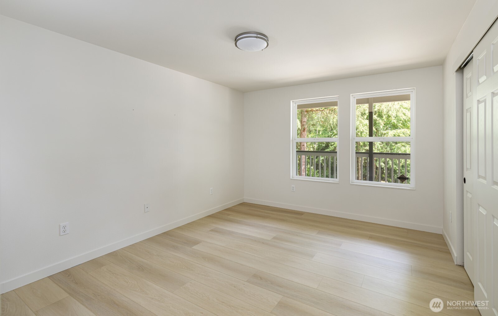 7605 Northeast Hidden Cove Road Bainbridge Island, WA 98110 - Photo 33 of 36 a view of an empty room with a window
