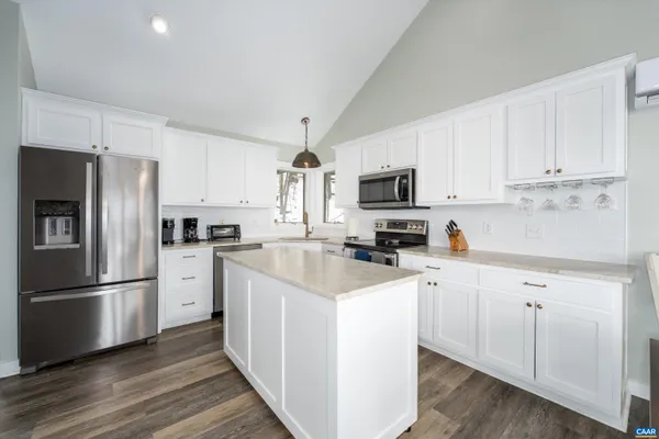 a living room with furniture fireplace and flat screen tv
