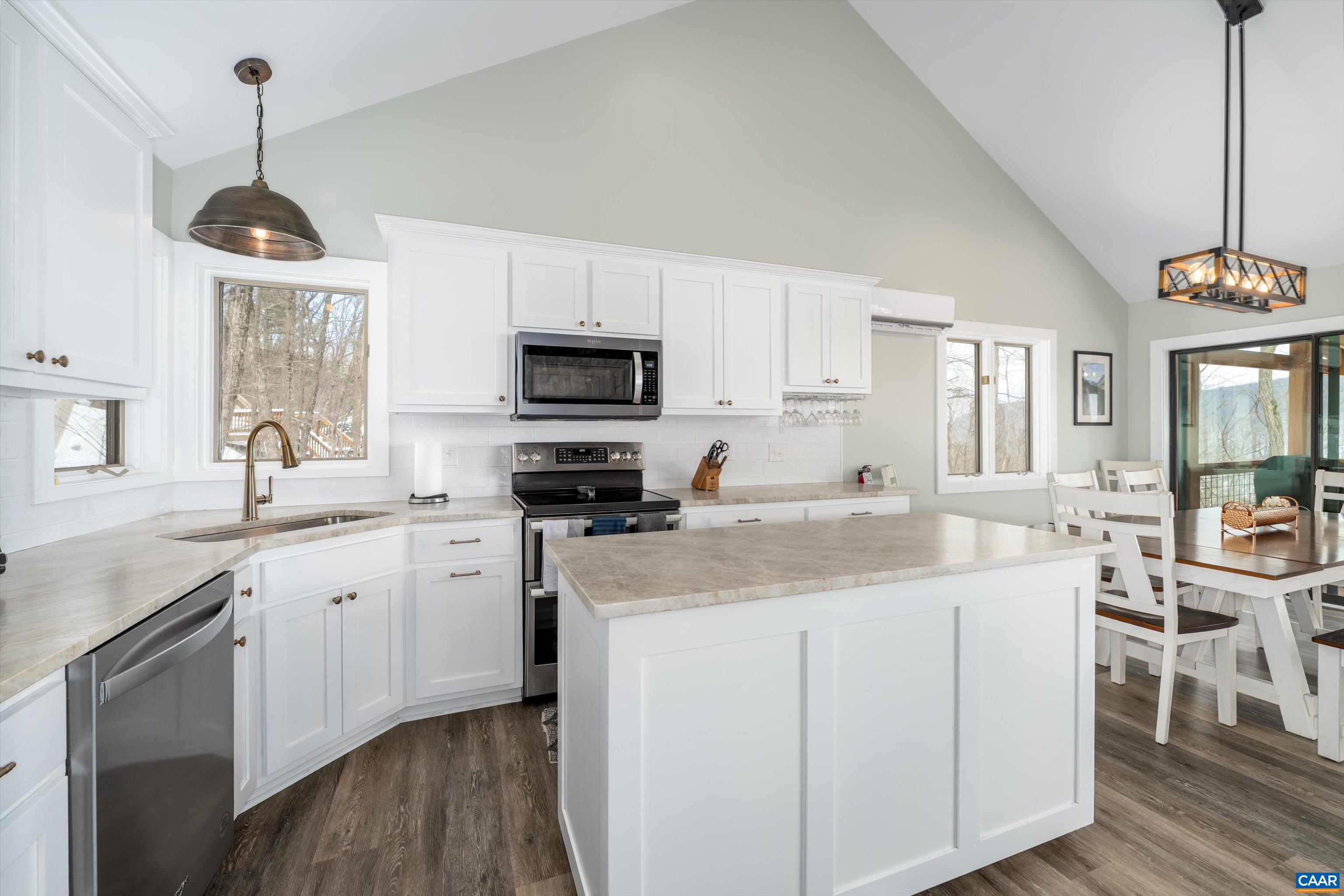 131 Crawfords Edge Wintergreen, VA 22967 - Photo 25 of 75 a kitchen with stainless steel appliances granite countertop a sink a stove a refrigerator and cabinets
