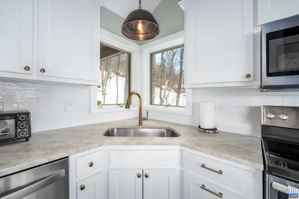 a bathroom with a shower and a window
