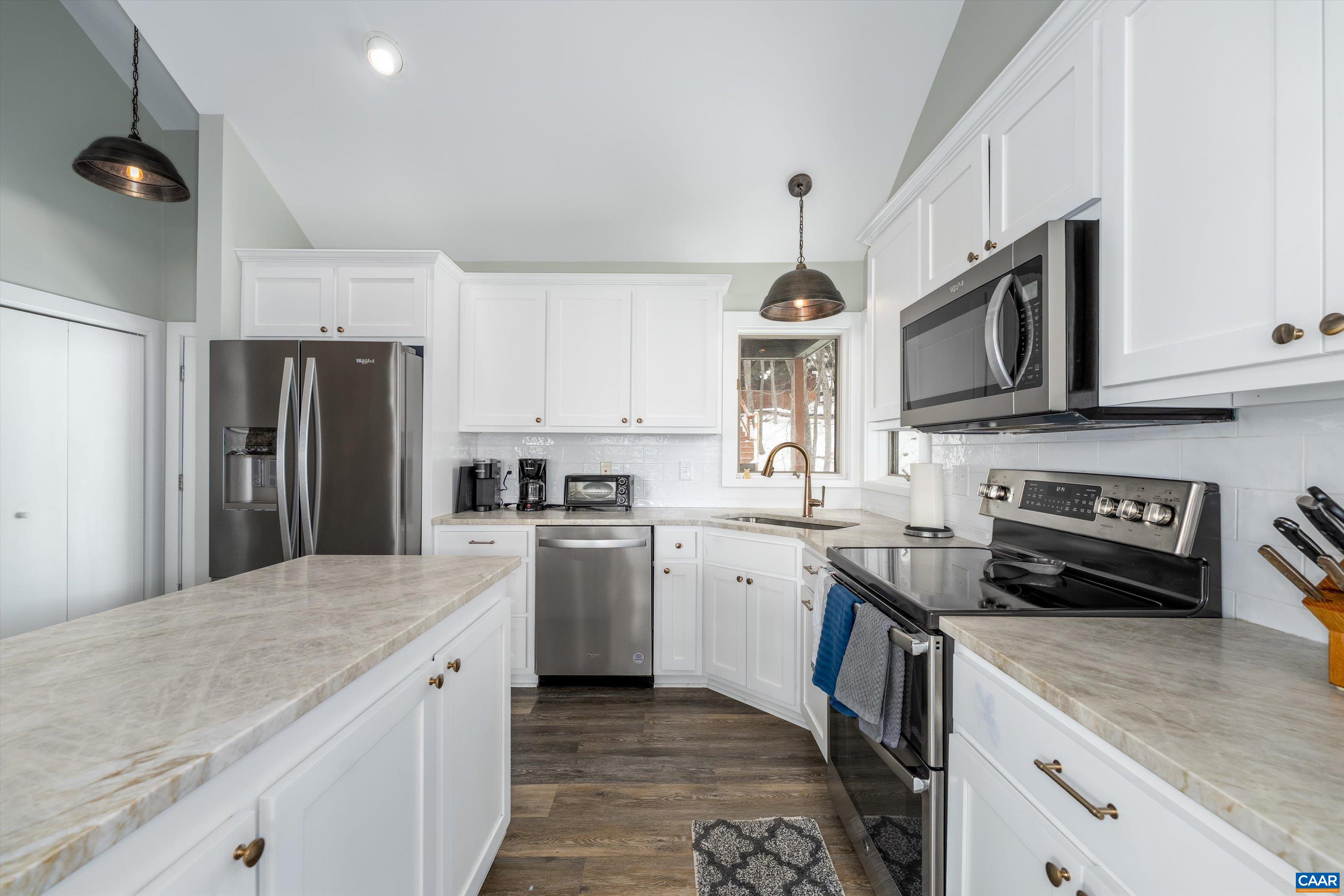 131 Crawfords Edge Wintergreen, VA 22967 - Photo 28 of 75 a kitchen with stainless steel appliances granite countertop a refrigerator stove microwave and sink