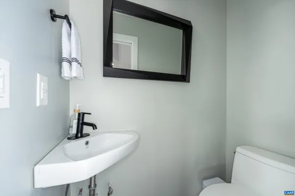 a view of a balcony with two chairs and a table
