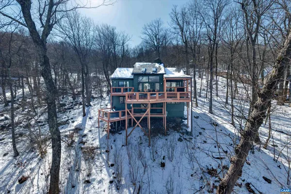a view of a chairs and table in the patio