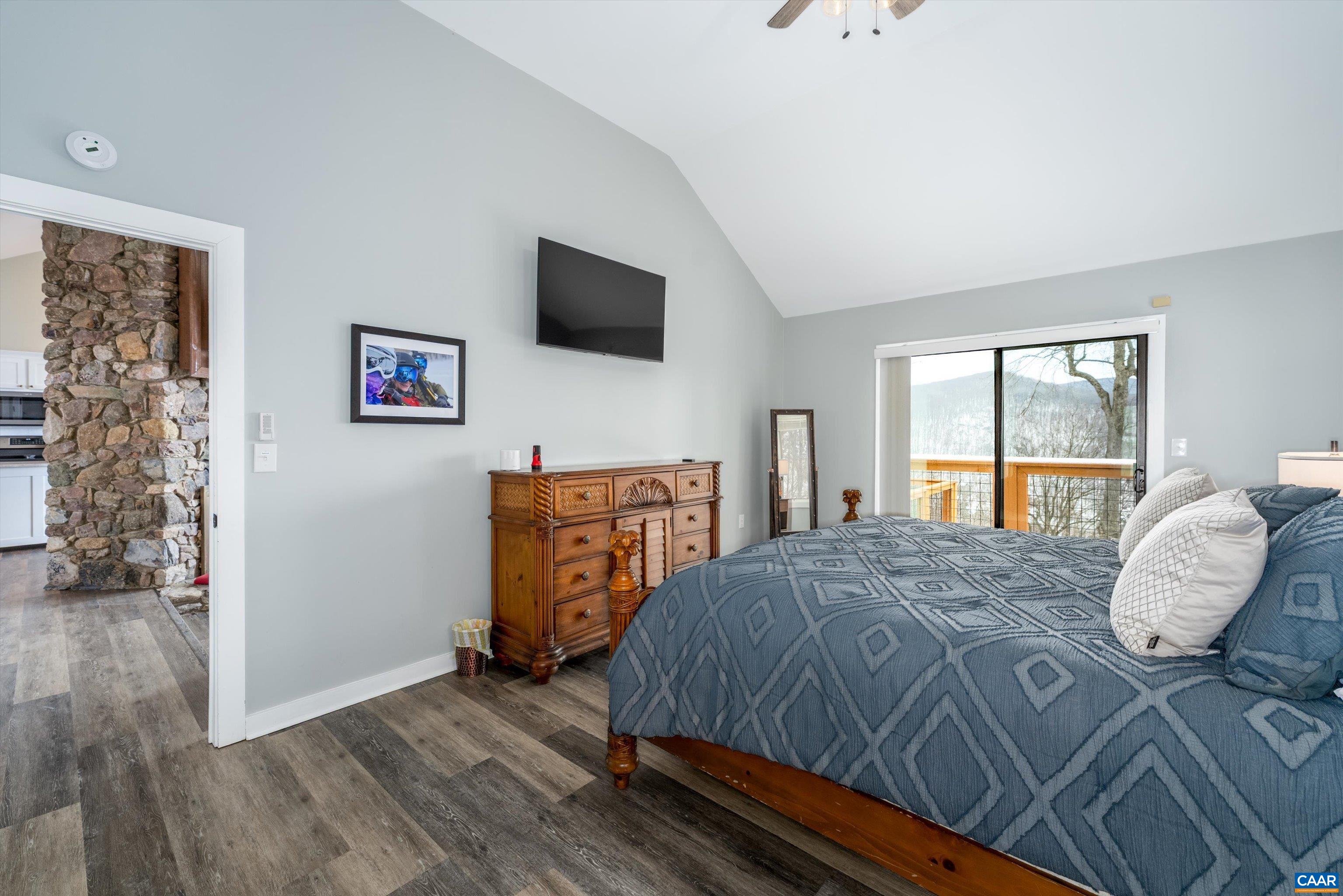 131 Crawfords Edge Wintergreen, VA 22967 - Photo 34 of 75 a bedroom with a bed and a flat screen tv