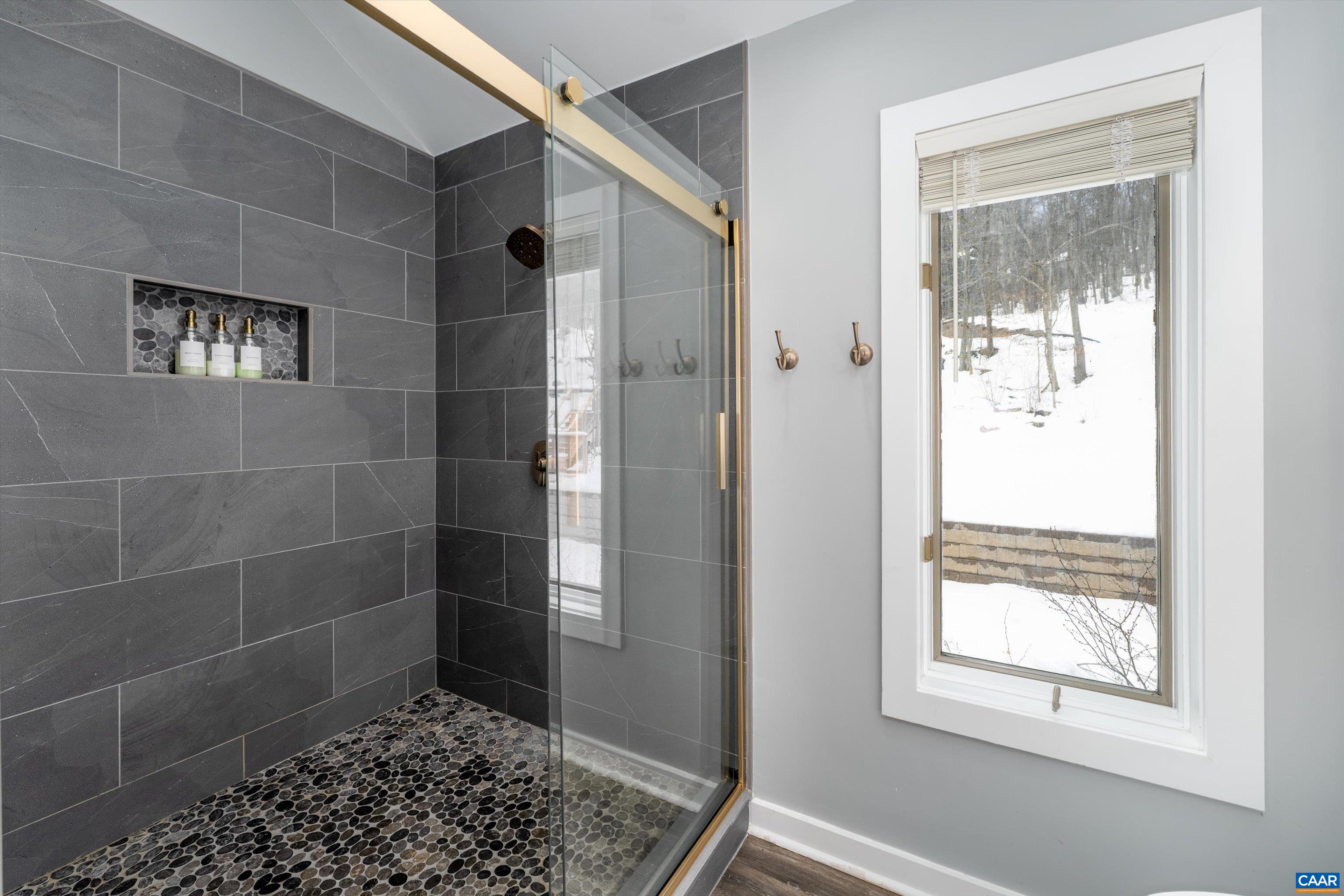 131 Crawfords Edge Wintergreen, VA 22967 - Photo 38 of 75 a bathroom with a shower and a window
