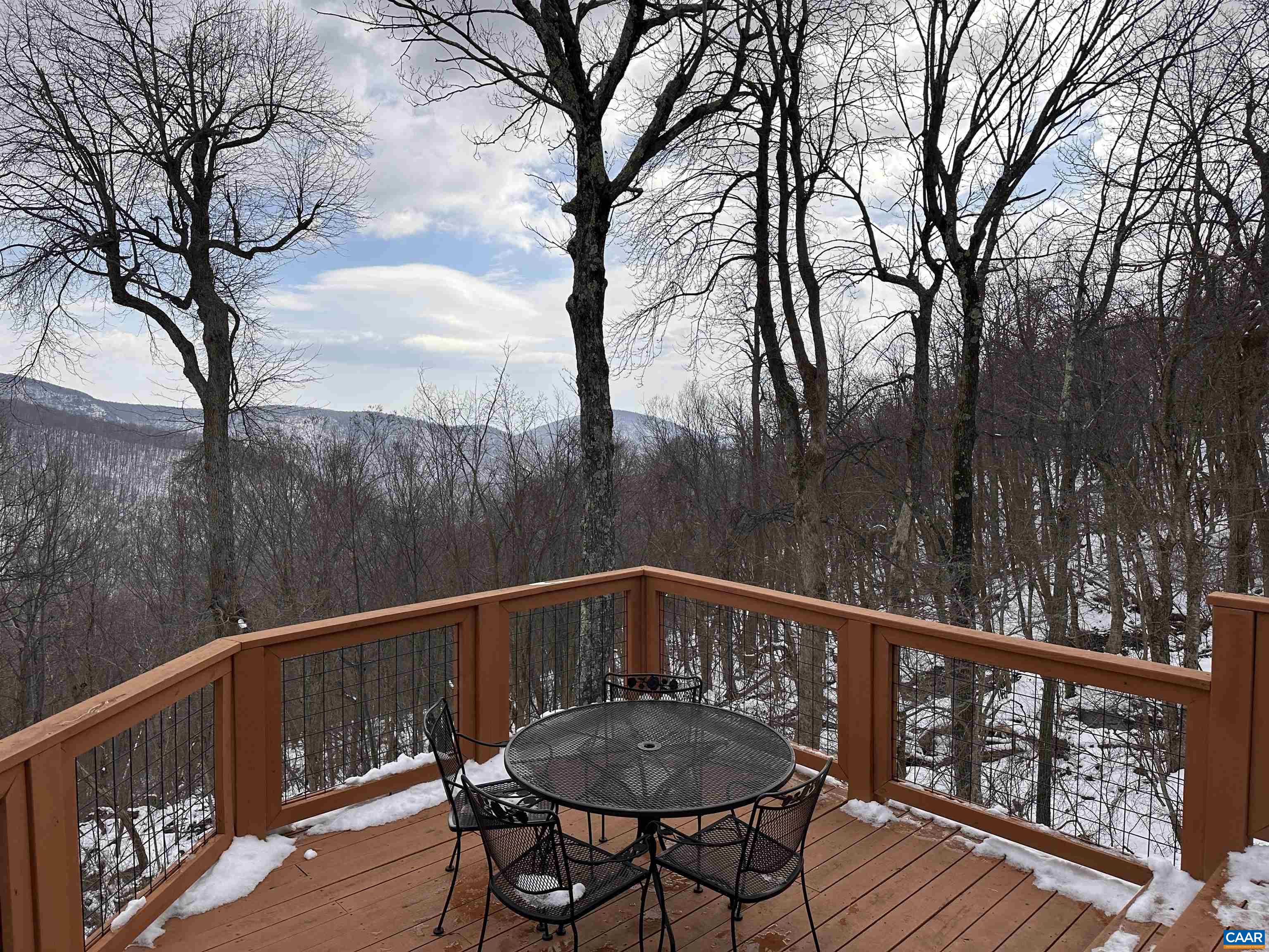 131 Crawfords Edge Wintergreen, VA 22967 - Photo 51 of 75 a view of a wooden deck with furniture and trees
