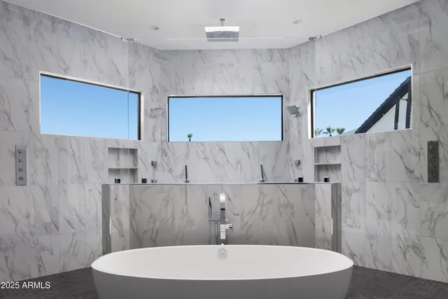 a living room with furniture a table and a fireplace