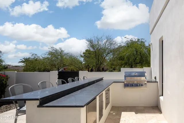 a view of a patio with swimming pool table and chairs