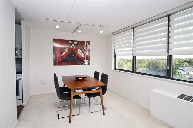 a dining room with furniture and window