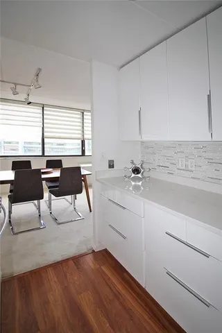 a view of living room with granite countertop furniture and fireplace