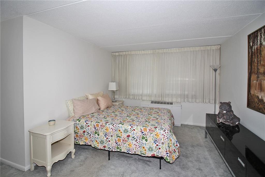 1160 Bower Hill Road, Unit 1101B Pittsburgh, PA 15243 - Photo 17 of 33 a bedroom with a bed and a window