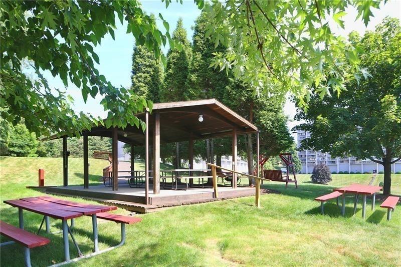 1160 Bower Hill Road, Unit 1101B Pittsburgh, PA 15243 - Photo 32 of 33 a patio with yard table and chairs