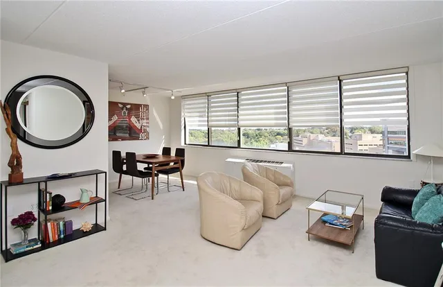 a living room with furniture and a large window