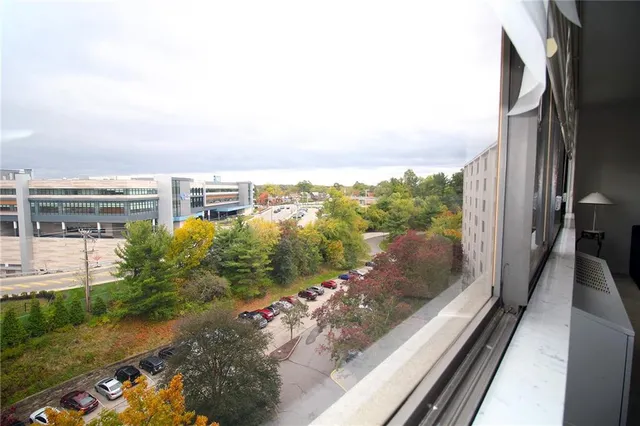 a view of a balcony with yard