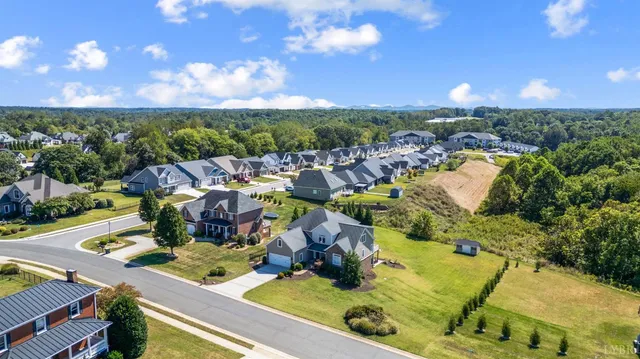 a view of a swimming pool and outdoor seating
