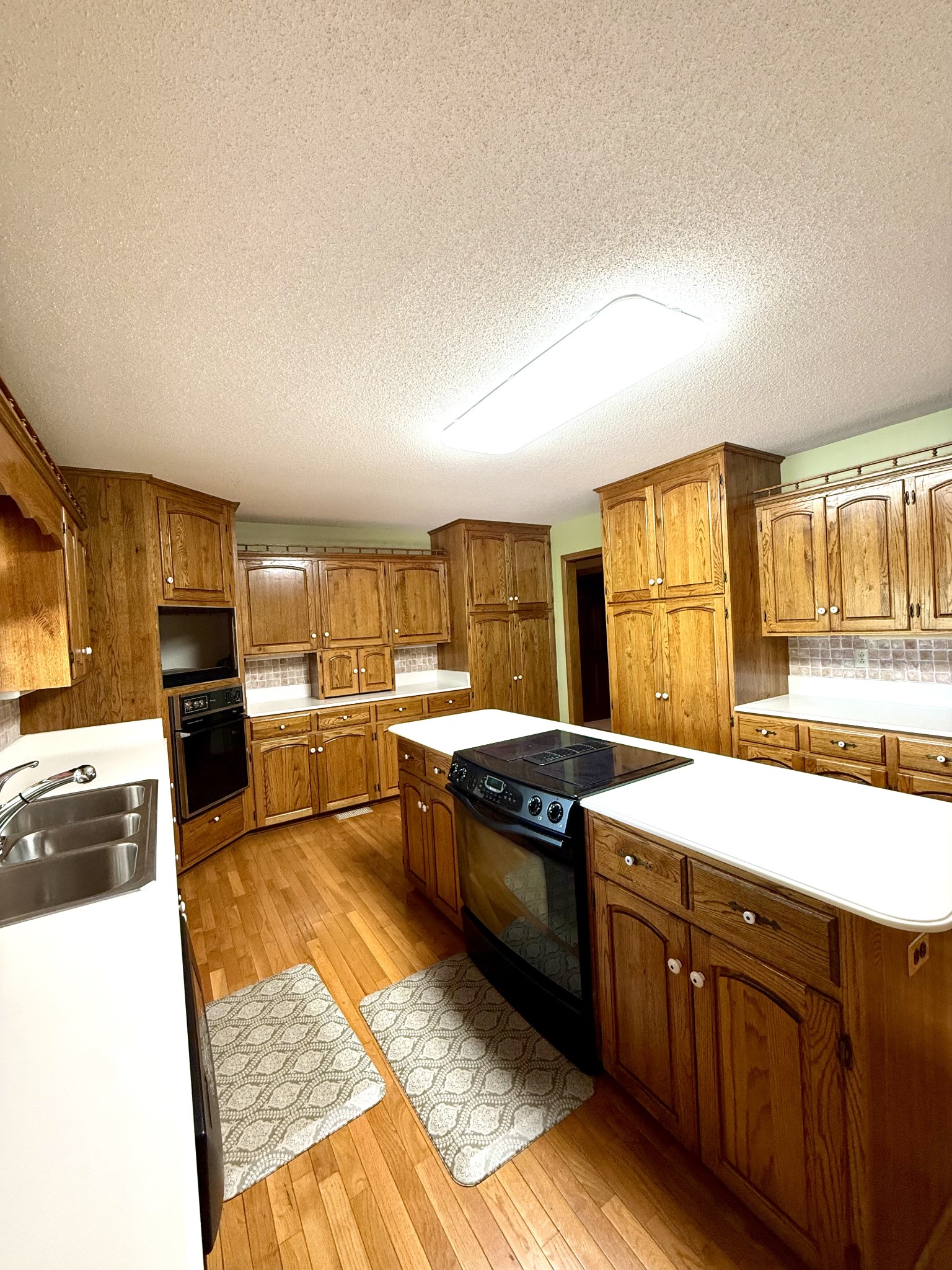 28 Ok Road Lawrenceburg, TN 38464 - Photo 11 of 76 a kitchen with stainless steel appliances granite countertop a sink stove and cabinets