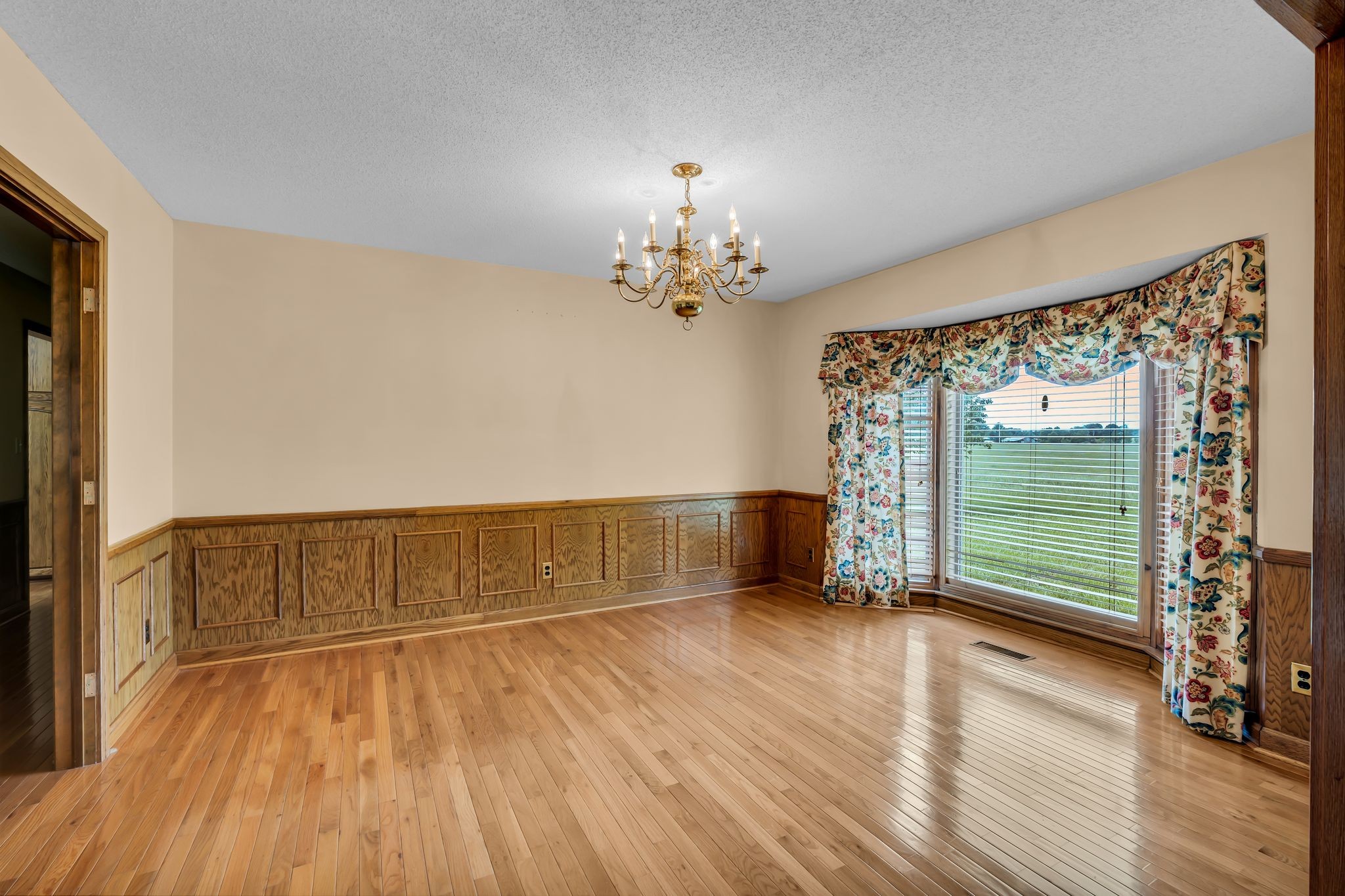 28 Ok Road Lawrenceburg, TN 38464 - Photo 15 of 76 a view of an empty room with wooden floor and a window