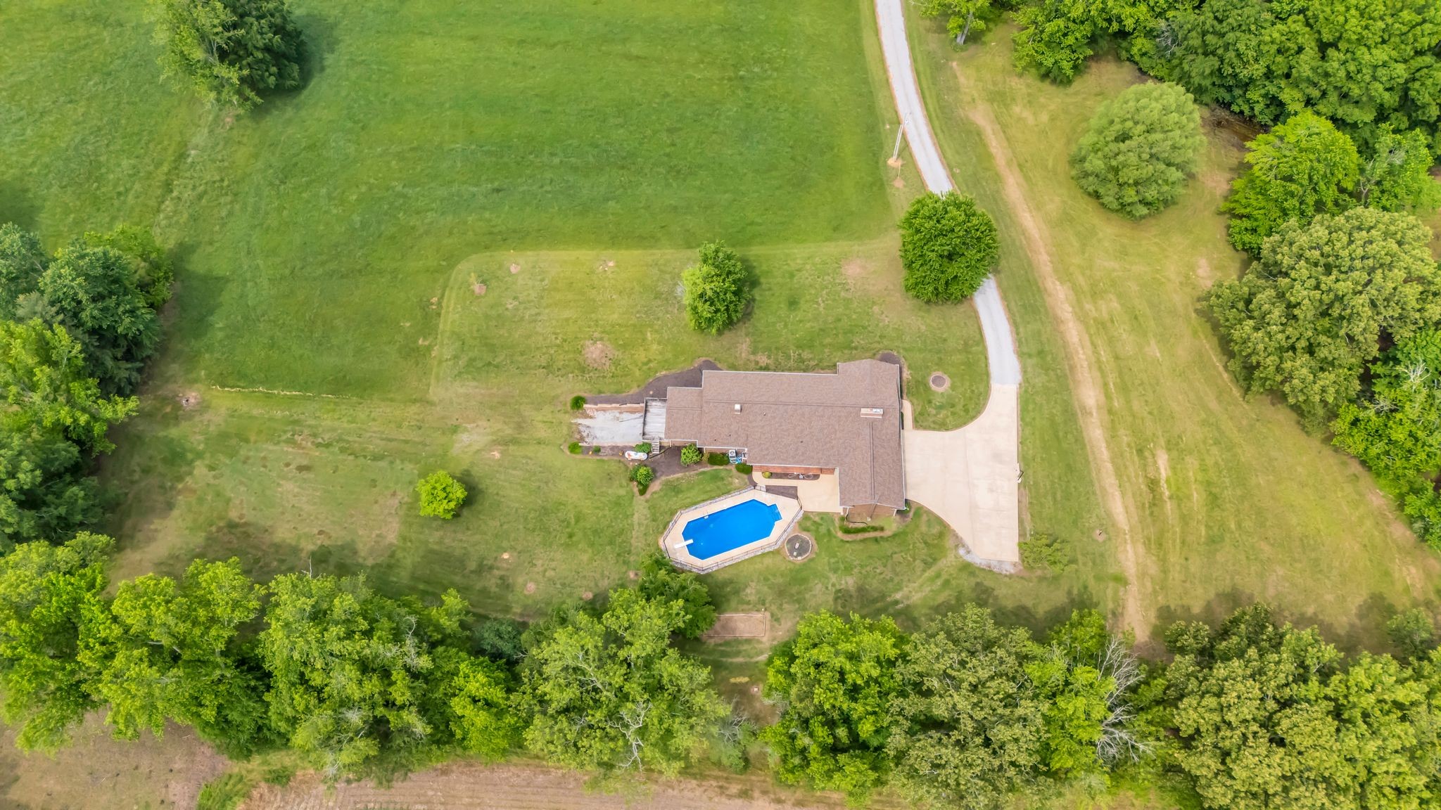 28 Ok Road Lawrenceburg, TN 38464 - Photo 72 of 76 an aerial view of a house with a yard swimming pool outdoor seating and yard